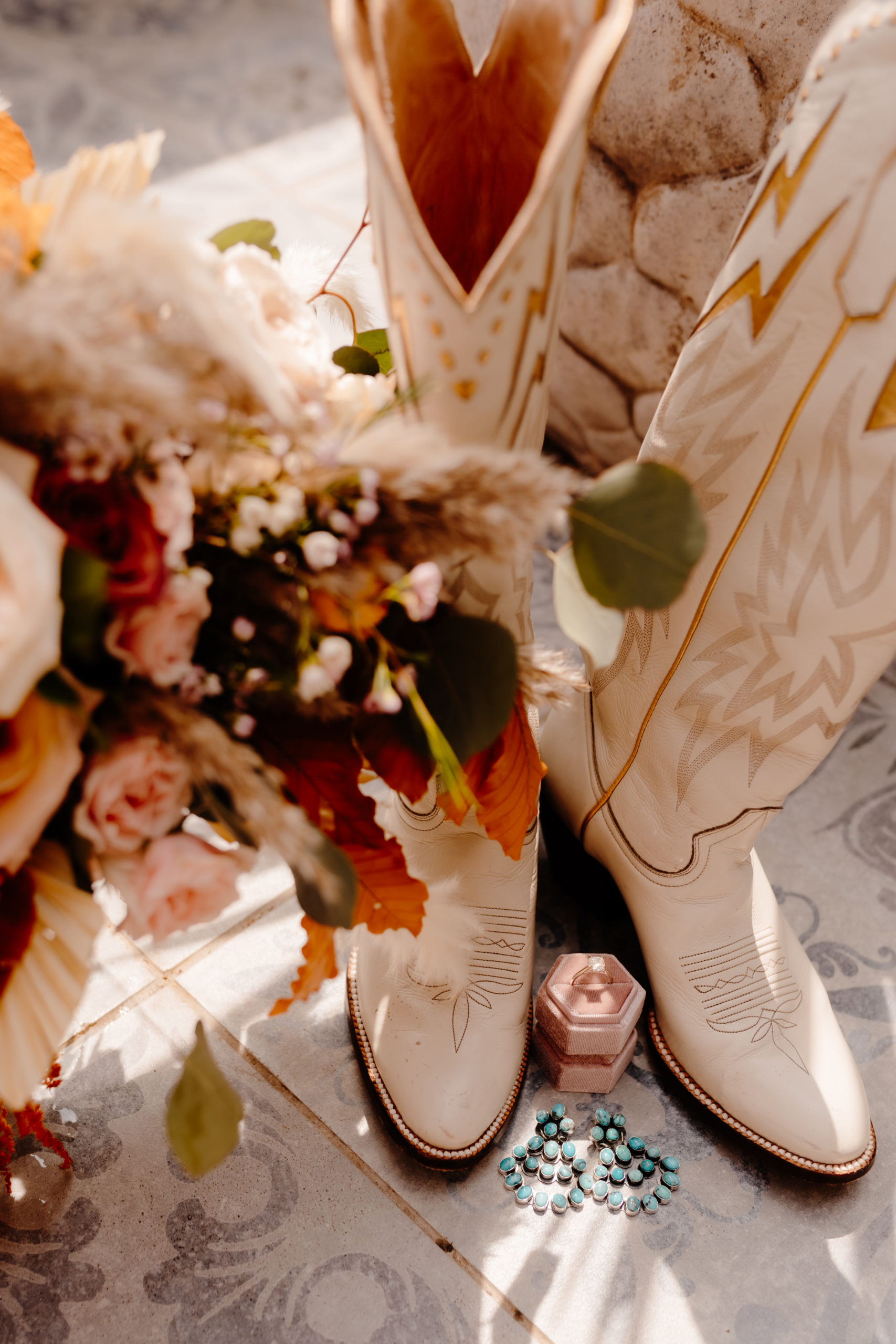bridal bouquet and cowboy boots