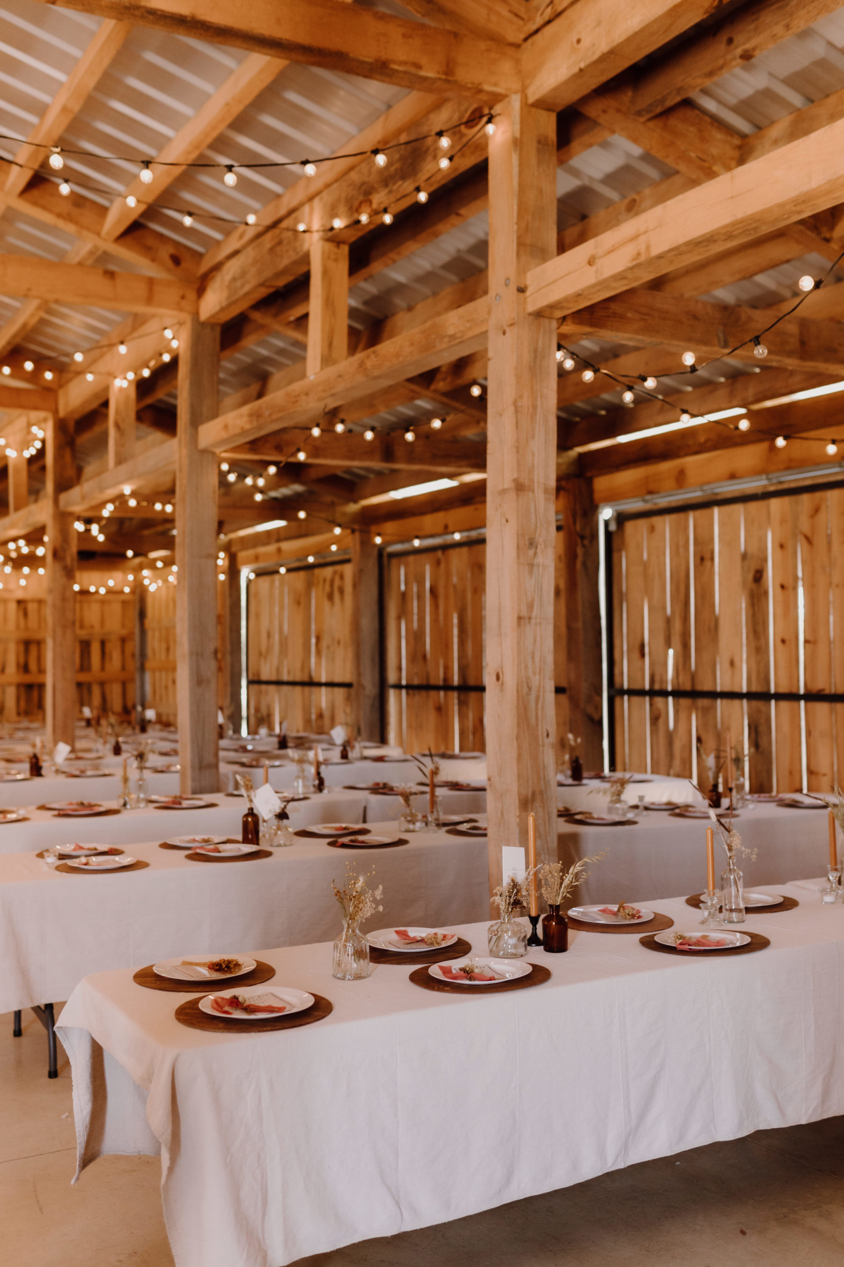 guest dining tables with terracotta colored place settings