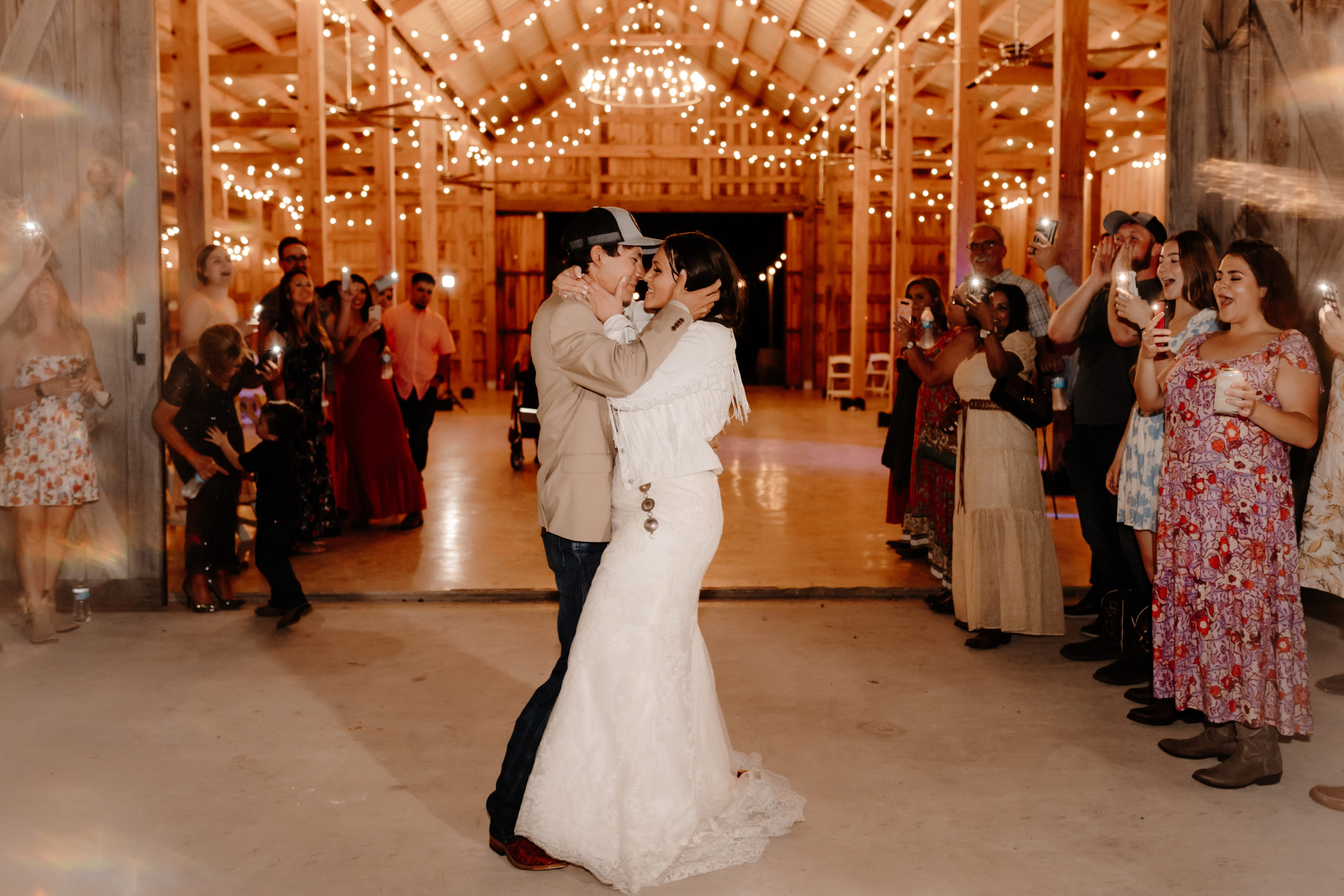 bride and groom kiss during sparkler exit